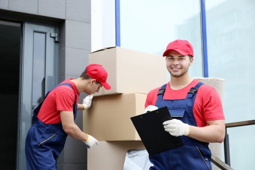 Professional packing team handling household items