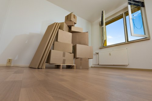 Professional moving team handling household items